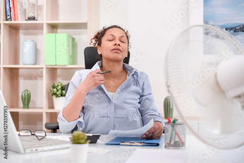 Woman sweating and suffering for summer heatwave