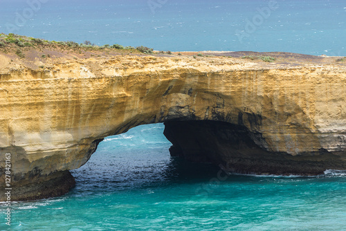 Natural Arch Over Turquoise Ocean photo