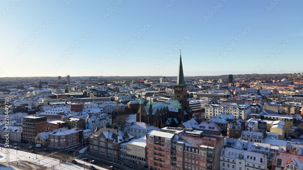 Aerial ascent of Aarhus, Denmark downtown cathedral in winter Aerial ascent of Aarhus, Denmark downtown cathedral in winter