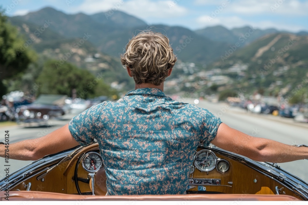 Fototapeta premium Joyful drive through mountainous landscape on a sunny day with a classic car and a stylishly dressed driver