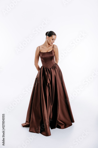 Wallpaper Mural Tall brunette with hairstyle in dark brown luxurious fashionable dress with train isolated on white background Torontodigital.ca