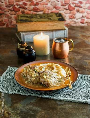 bangers and mash - beef patties with mashed potato and gravy