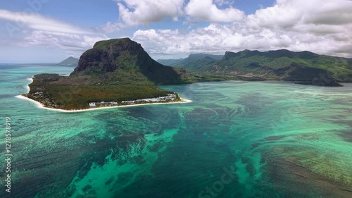 Wallpaper Mural Stunning aerial footage of Le Morne Brabant peninsula with turquoise lagoon and underwater waterfall. Breathtaking view of coast with luxury beach resorts at the foot of iconic mountain in Mauritius Torontodigital.ca