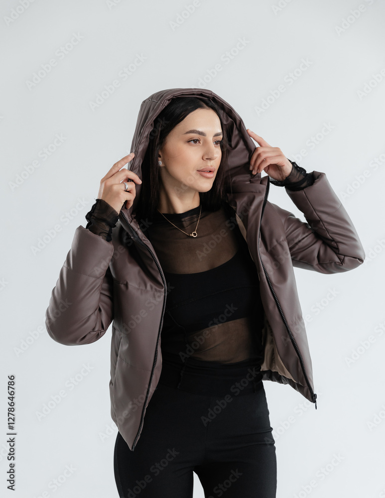 Portrait of a cute girl model in a leather jacket on a white background isolated in the studio Portrait of a cute girl model in a leather jacket on a white background isolated in the studio