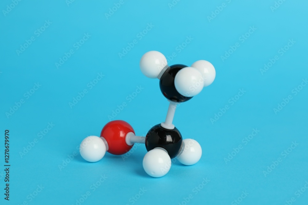 Molecule of ethanol on light blue background. Chemical model Molecule of ethanol on light blue background. Chemical model