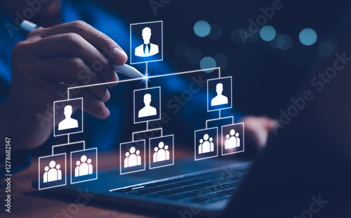 Obraz na płótnie Businessman point a glowing digital organizational chart, leadership and team structure. Manager team management of company, networking in business hierarchy job concept, president job change control w salonie