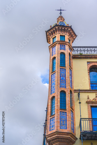 Architectural detail of a decorative tower in Seville, Spain