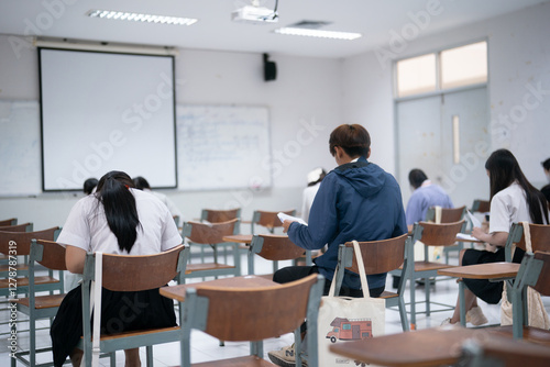 University Students Taking an Exam in a Classroom