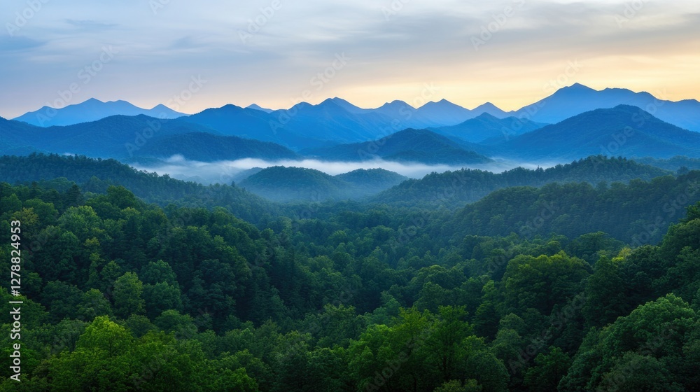 Obraz premium Lush green mountains stretch across horizon, veiled in soft morn