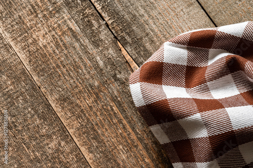 A kitchen napkin on an old wooden table