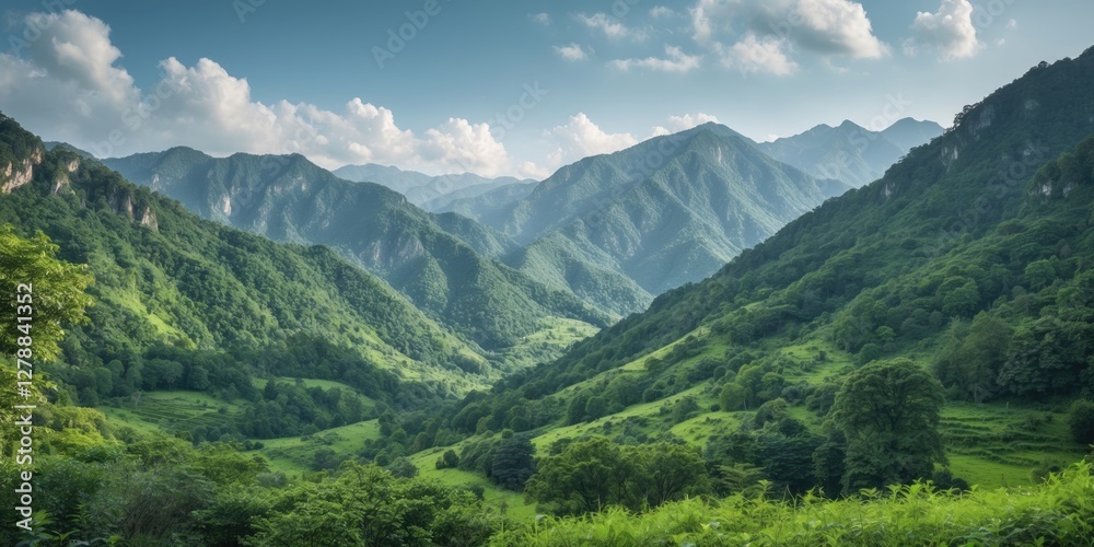 Lush green valley surrounded by mountains under blue sky with clouds providing a panoramic view of nature's landscape. Lush green valley surrounded by mountains under blue sky with clouds providing a panoramic view of nature's landscape.