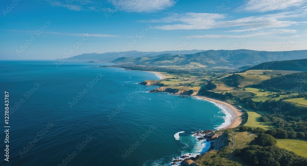 Aerial view of a scenic coastal landscape featuring lush green hills, a sandy beach, and clear blue waters under a bright sky. Aerial view of a scenic coastal landscape featuring lush green hills, a sandy beach, and clear blue waters under a bright sky.