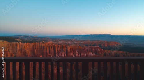 Obraz na płótnie Expansive landscape featuring majestic cliffs bathed in warm sun w salonie