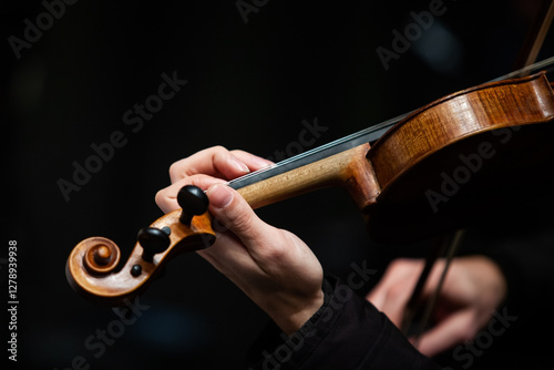  Close-up of a musician's hand playing the violin