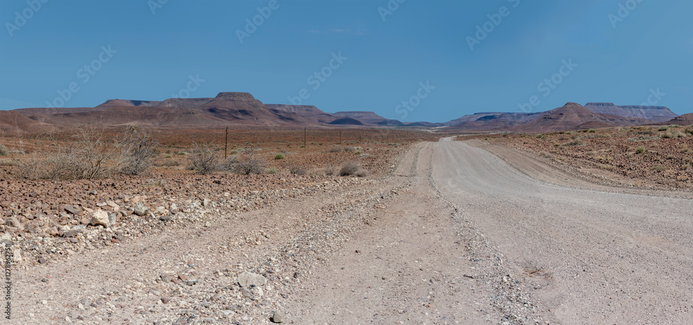 C39 dirt road winding in desert, near Bergsig, Namibia