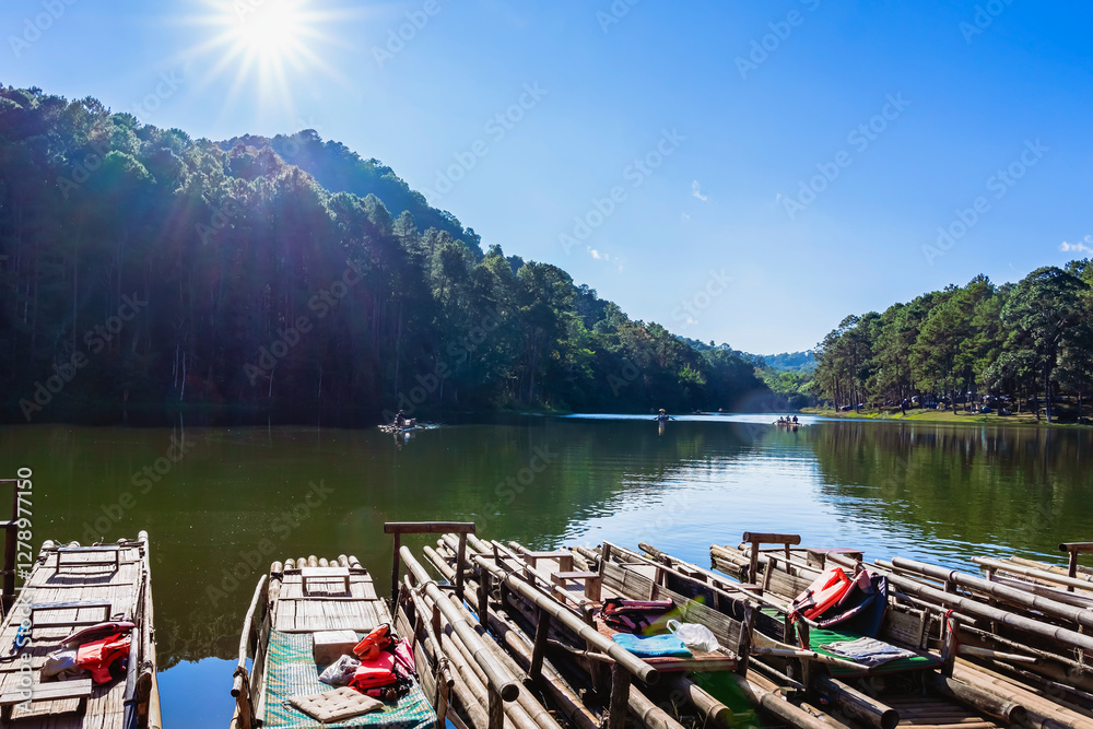 Naklejka premium Beautiful destination nature lake and forest of Pang Oung lake and pine forest in Mae Hong Son, Thailand. Nature landscape. Environmental friendly outdoor activity and camping surrounded by valley.