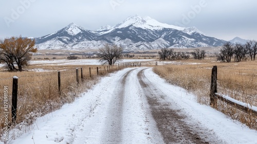 Snowy mountain road through a rural landscape photo