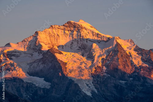 sunset over snowy mountains