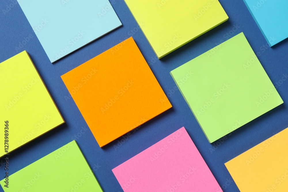 Multicolored paper sticker on a blue background Multicolored paper sticker on a blue background