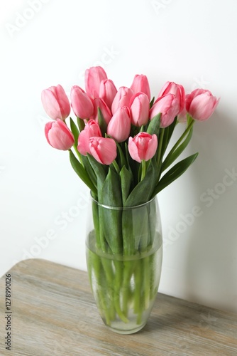 Wallpaper Mural Beautiful fresh tulips in a vase on the table Torontodigital.ca