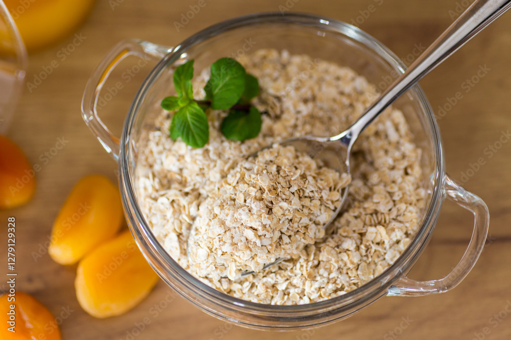 Εκτύπωση καμβά Healthy raw oatmeal in bowl on wooden table