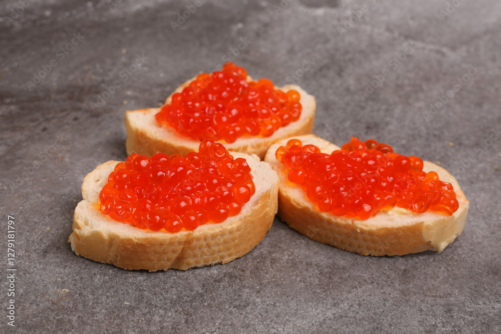 sandwiches with red caviar on a light background sandwiches with red caviar on a light background