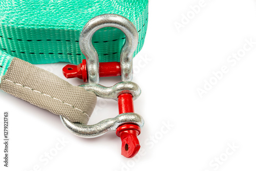 Car towing stop with metal shackles included. Car recovery kit with bow-shaped bracket and towing strap. Close-up on white background. Copy space photo