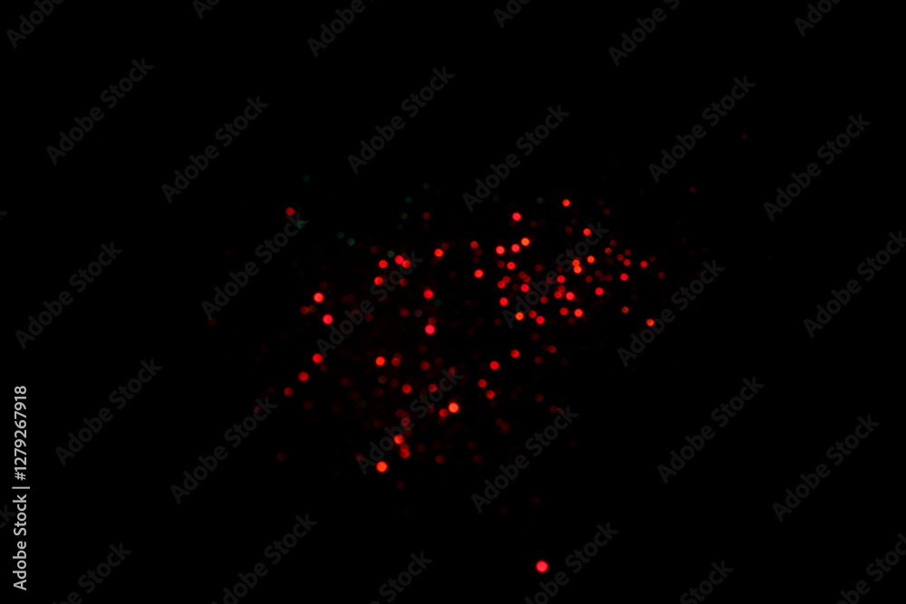 Fotografie Red blurred bokeh lights on black background
