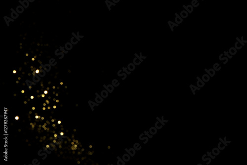 Golden blurred bokeh lights on black background. Glitter sparkle stars for celebrate. Overlay for your design