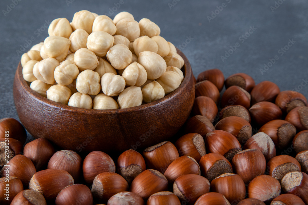 Heap of peeled and shelled hazelnuts on black background,closeup Heap of peeled and shelled hazelnuts on black background,closeup