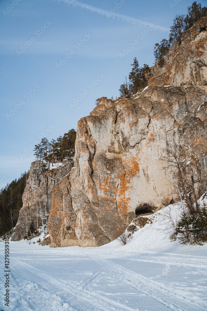 In a snowy mountain landscape, a large cave uniquely nestles amid the icy expanse, creating a stunning contrast against the pristine white scenery, making it truly remarkable to observe In a snowy mountain landscape, a large cave uniquely nestles amid the icy expanse, creating a stunning contrast against the pristine white scenery, making it truly remarkable to observe