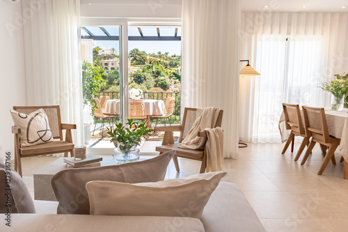 a luxury living and dining room area in mediterranean holiday real estate 