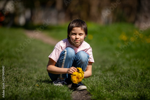 Portrait of little adorable girl walking in park