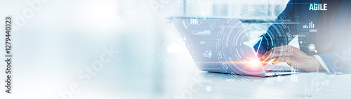 Agile: Businessman uses laptop to analyze and develop various information about project management on future virtual interface. Iteration, flexibility, collaboration, continuous improvement