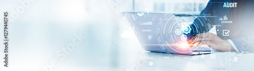 Audit: Businessman uses laptop to analyze and develop various information about financial records on future virtual interface. Compliance, risk assessment, data accuracy, performance evaluation