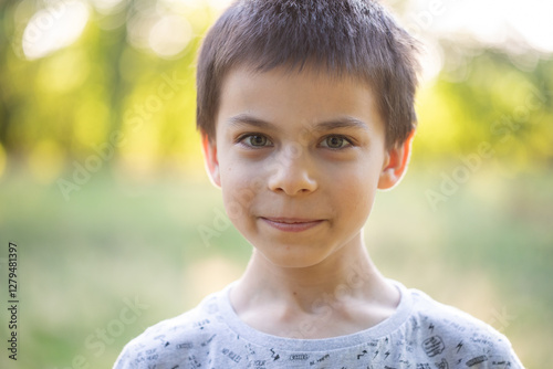Portrait of little adorable boy in park