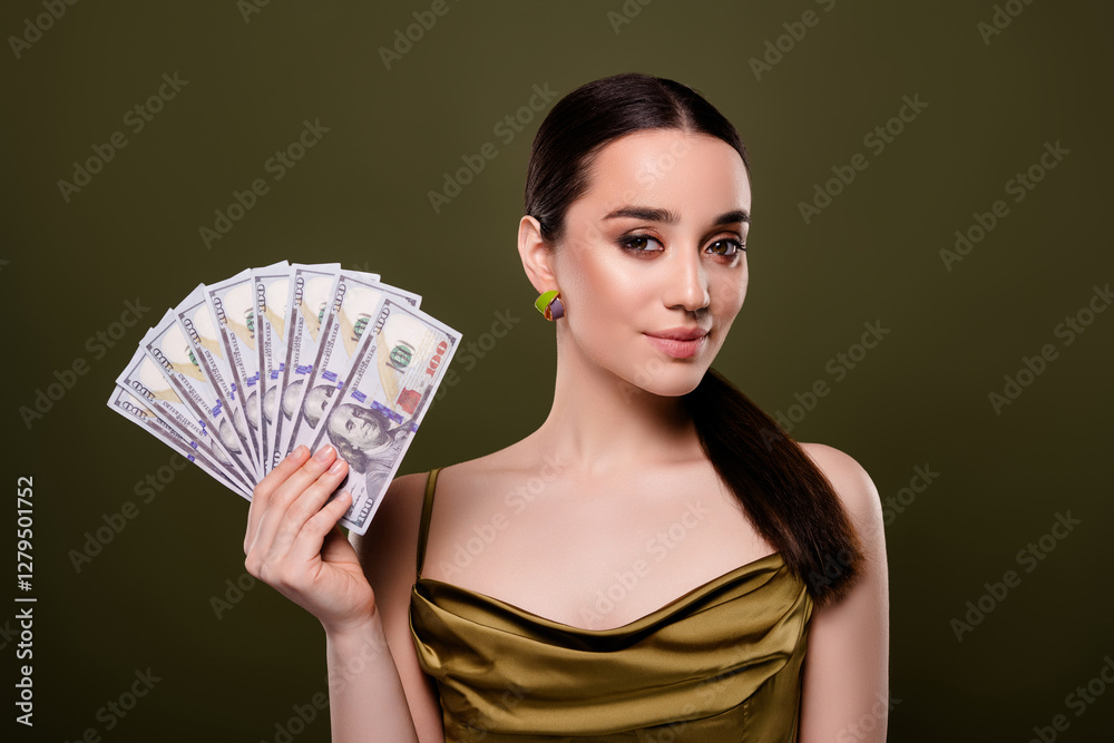 Photo of lovely gorgeous lady hold money casino winner dressed elegant garment isolated on khaki color background Photo of lovely gorgeous lady hold money casino winner dressed elegant garment isolated on khaki color background