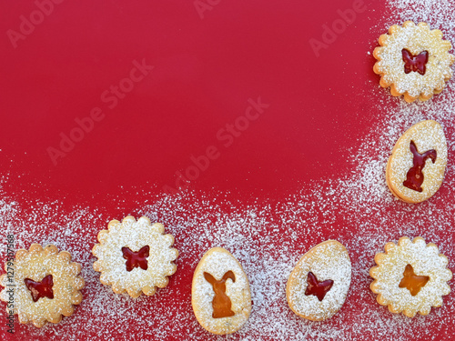 Easter background with Linzer cookies filled with strawberry and apricot jam, copy space for text photo