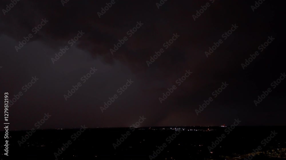 Dark storm clouds rolling in with electric lightning flashes Dark storm clouds rolling in with electric lightning flashes