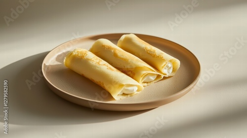 Golden Crepes: Three delicate, golden-hued crepes filled with creamy delight rest gracefully on a rustic plate, inviting a moment of culinary bliss.