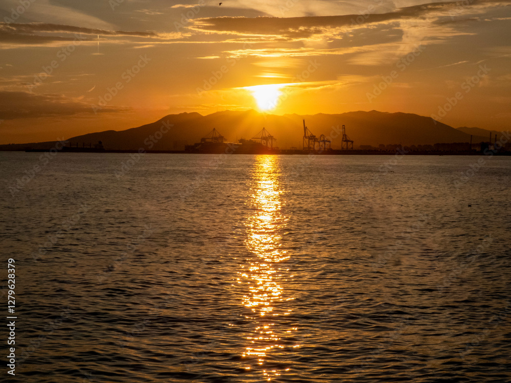 Sunset in Malaga port in southern Spain Sunset in Malaga port in southern Spain