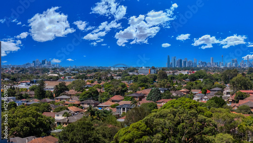 Obraz na płótnie Aerial Drone view looking down on Commercial Suburb of Burwood in Sydney residential houses in suburbia suburban house roof tops and streets park NSW Australia w salonie