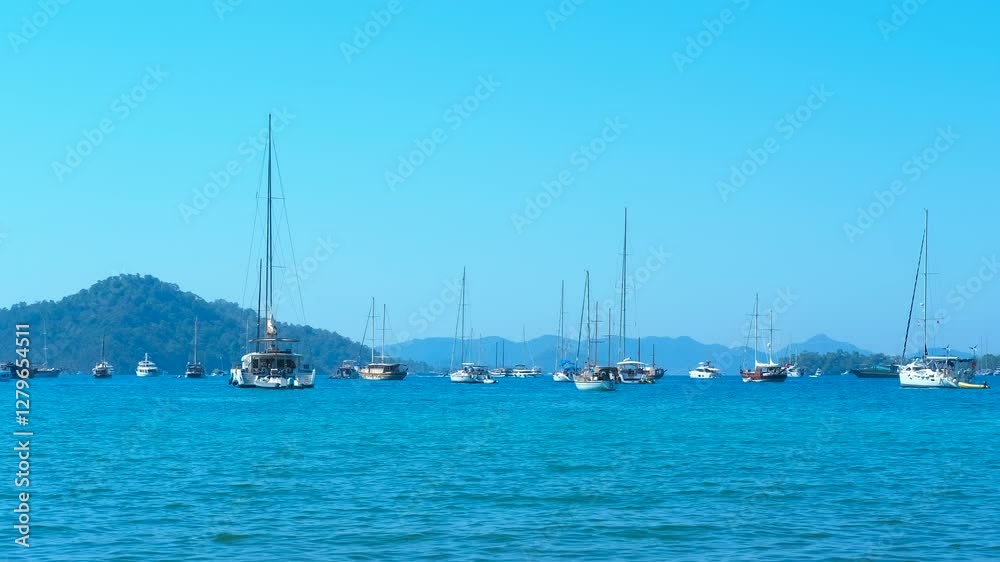 Sailboats float on calm waters under a clear blue sky, with picturesque islands dotting the horizon, creating a serene and idyllic landscape perfect for summer vacations Sailboats float on calm waters under a clear blue sky, with picturesque islands dotting the horizon, creating a serene and idyllic landscape perfect for summer vacations