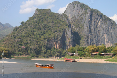 Boats on Mekong River near Pak Ou photo