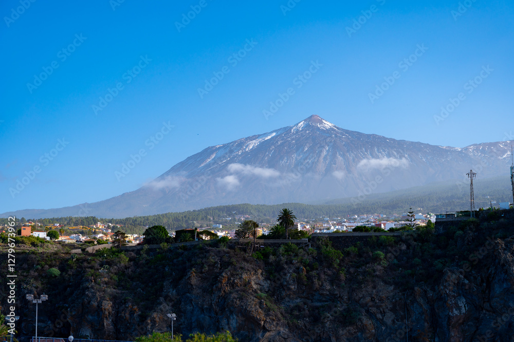 Fototapeta premium Full view on volcano Teide from Playa de San Marcos and Icod de los Vinos, north of Tenerife in January, Canary islands, Spain