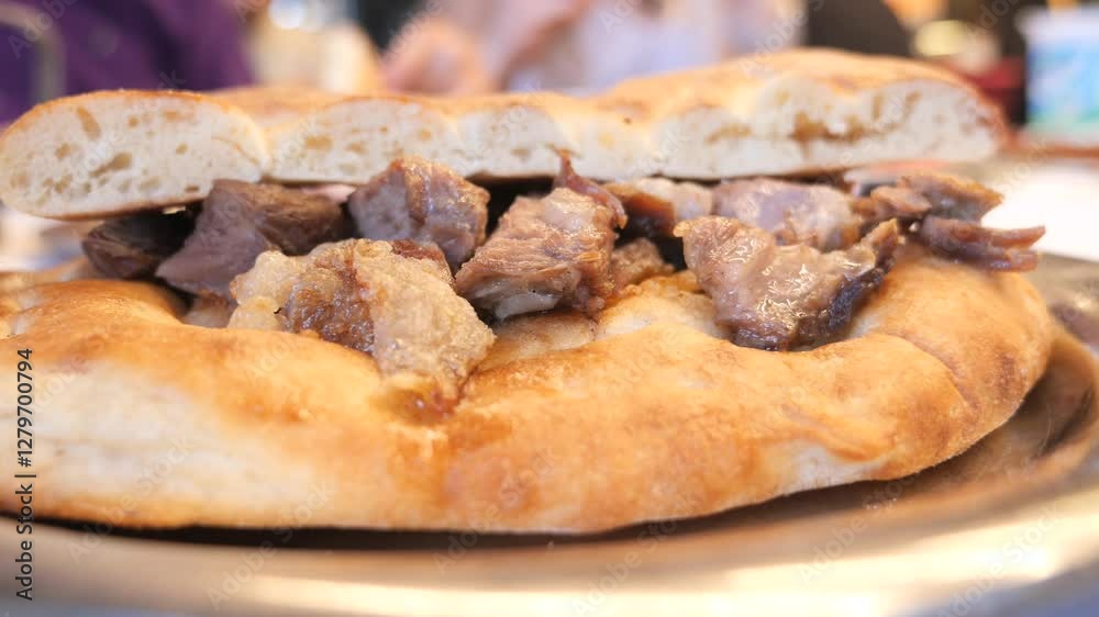 Enjoying traditional meat-filled flatbread at local eatery Enjoying traditional meat-filled flatbread at local eatery