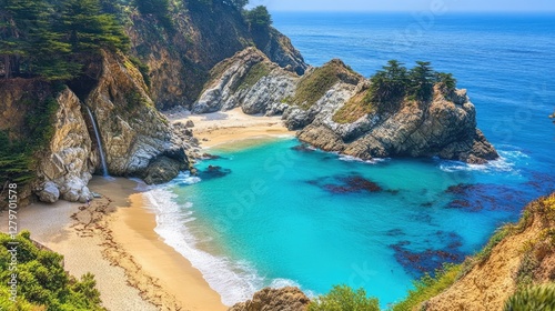 A high-angle view of a beach cove with clear blue water, rocky cliffs, and wide open sky.