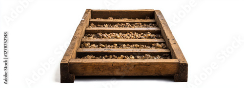 Wooden sluice box with gravel, ideal for mining and water flow