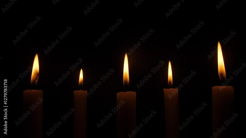 Five beautiful candles are gently illuminating the surrounding darkness with their warm and inviting flames Five beautiful candles are gently illuminating the surrounding darkness with their warm and inviting flames