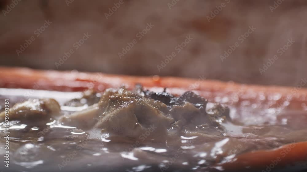 Cooking pot with bone broth meat pork and beef, aspic north food. Vegetables cooking ingredients and spices on kitchen table. Cooking pot with bone broth meat pork and beef, aspic north food. Vegetables cooking ingredients and spices on kitchen table.